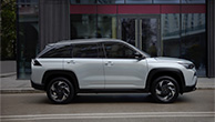 Across-silver-SUV-parked-in-urban-street-side-view
