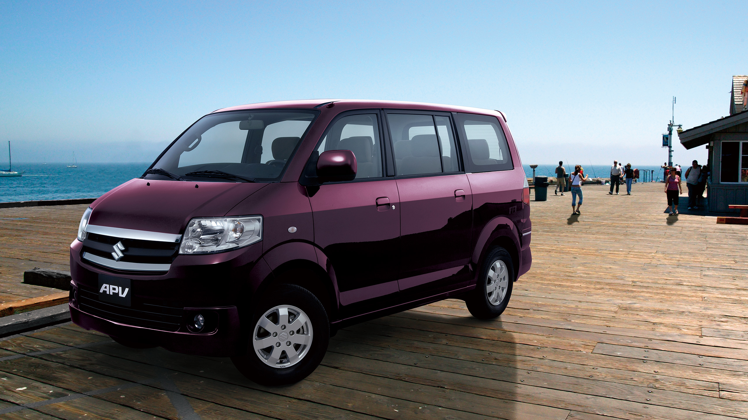 a-purple-APV-parked-near-the-ocean