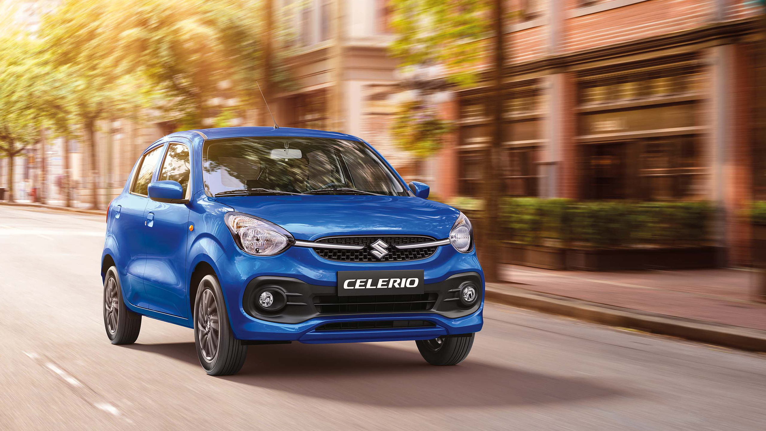 Blue-Suzuki-Celerio-running-in-a-town