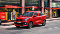 Red-Suzuki-Celerio-running-in-a-city