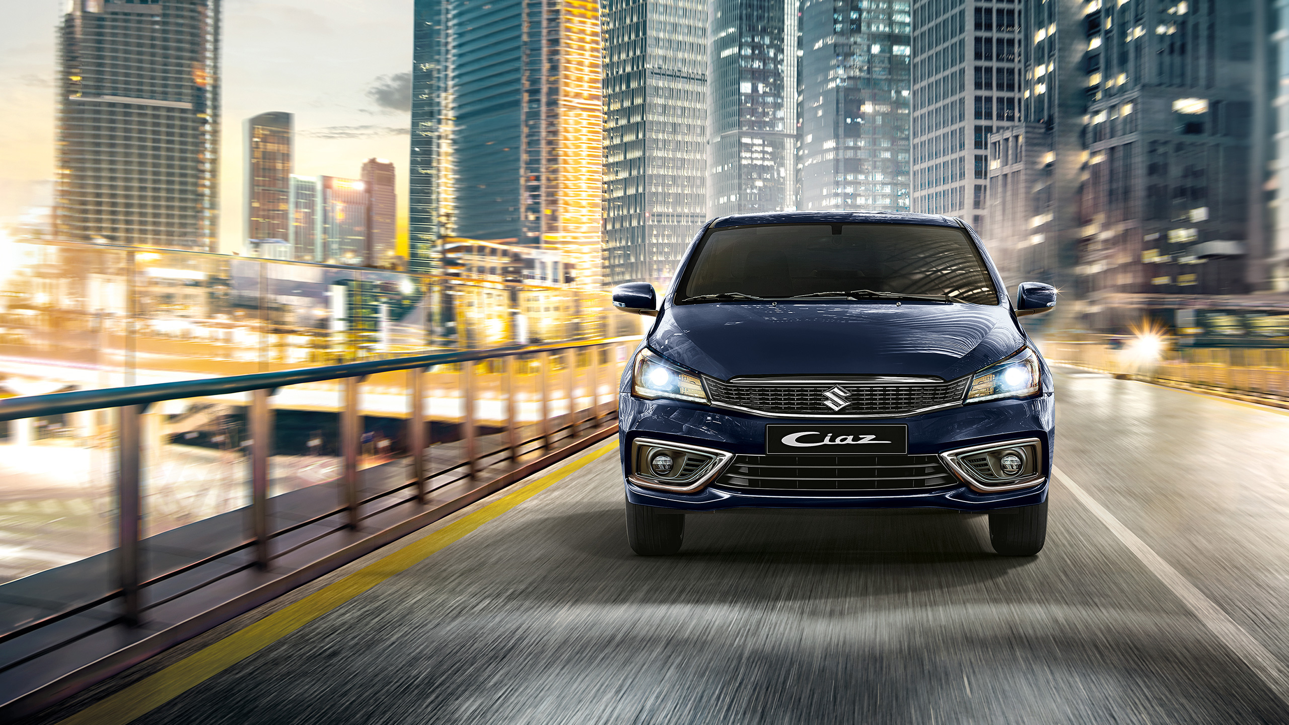 Front-shot-of-Ciaz-driving-on-highway-with-lights-on