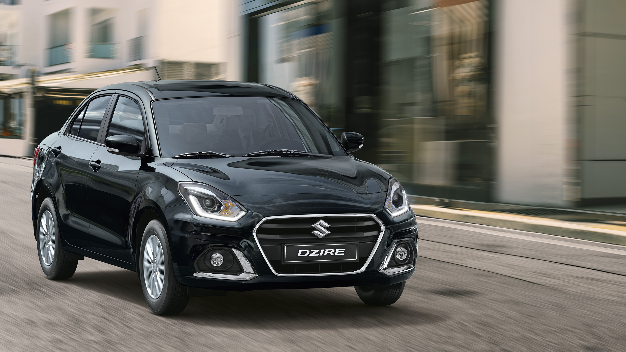 Front-shot-of-Dzire-driving-in-the-city