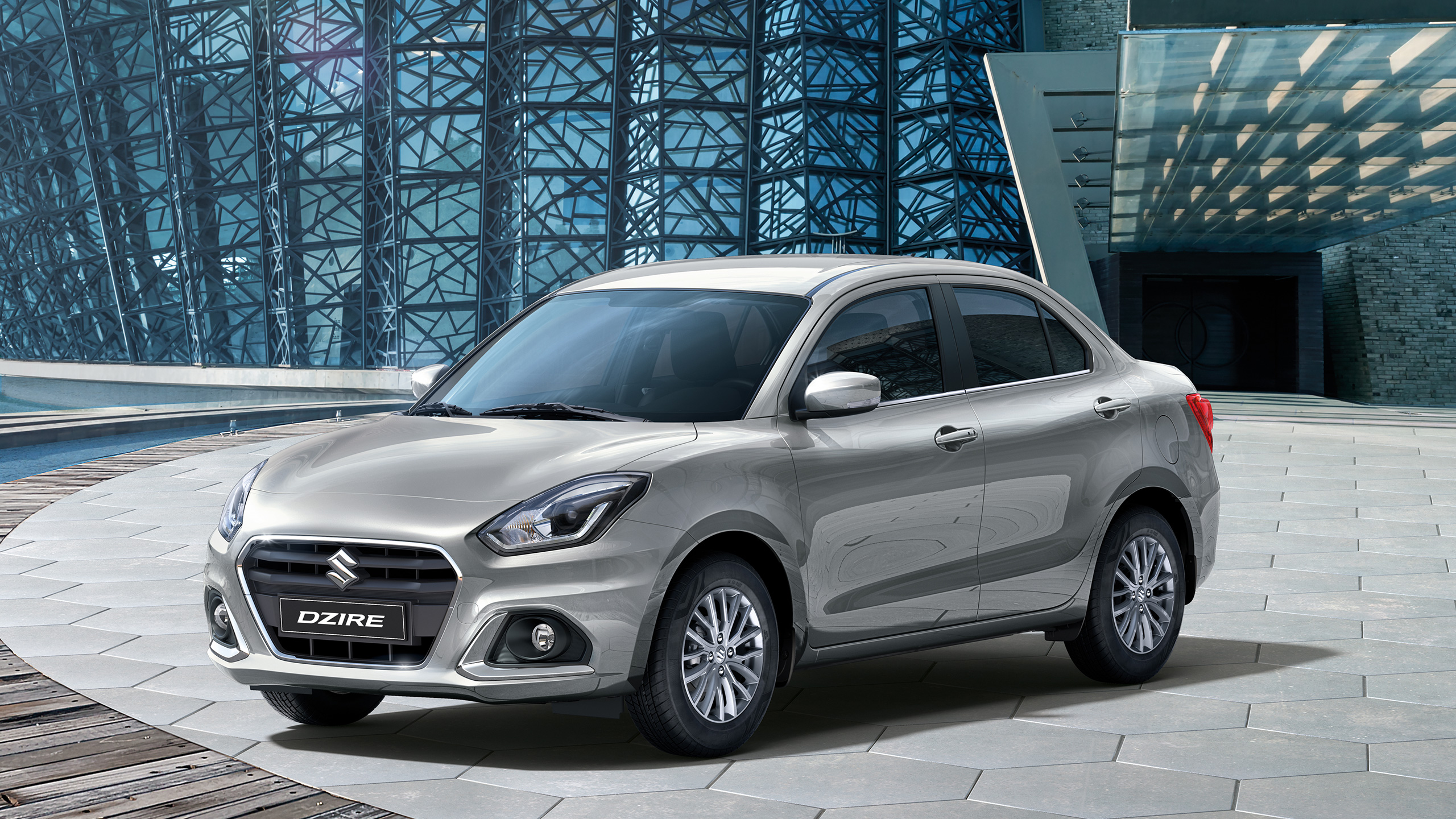 Front-shot-of-parked-Dzire-in-front-of-an-iconic-building