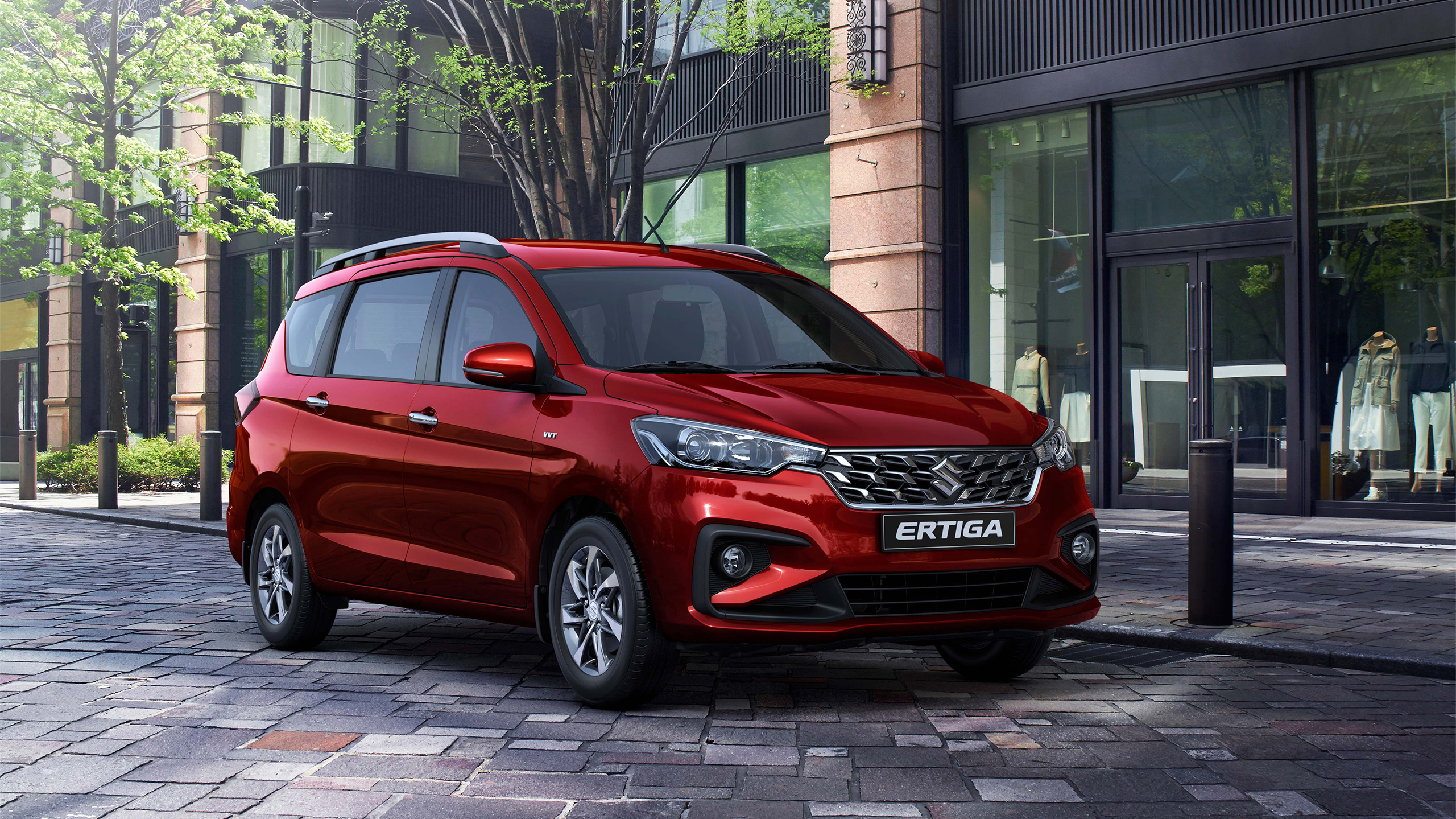 Red-Suzuki-Ertiga-parking-in-front-of-city-building