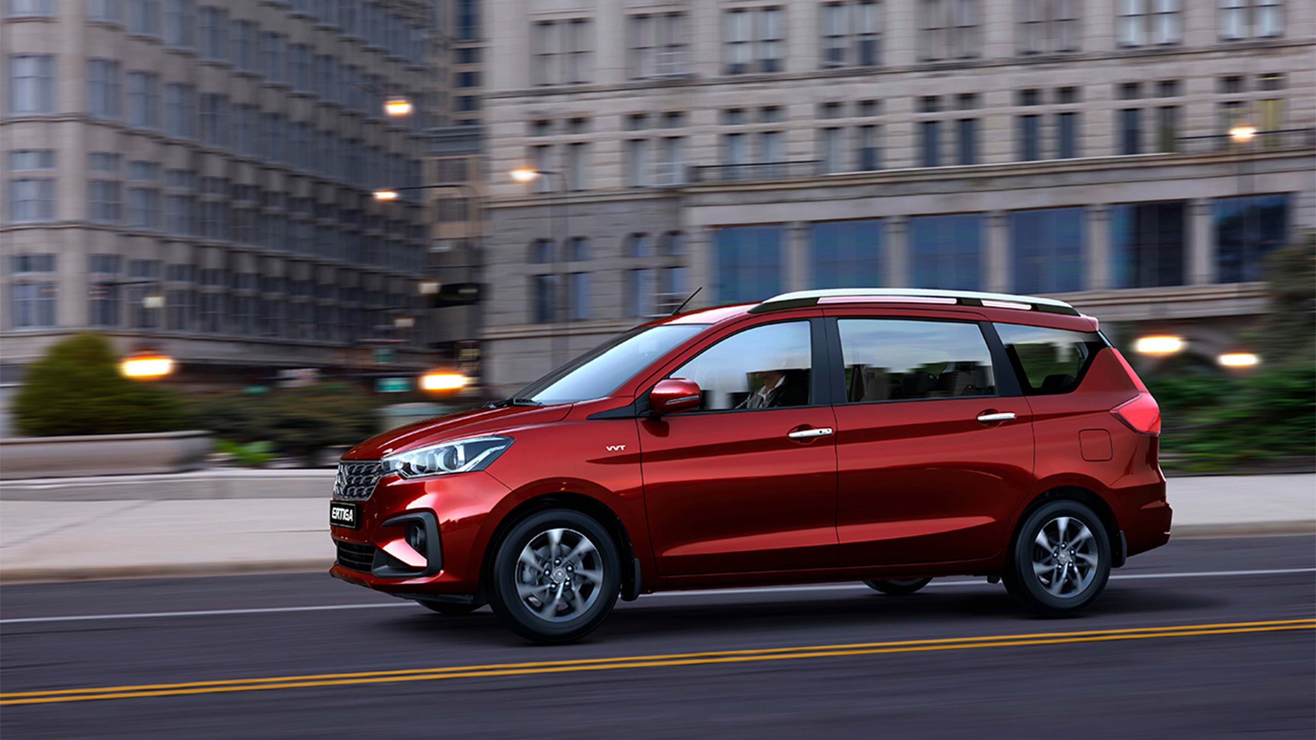 Red-Suzuki-Ertiga-driving-in-city