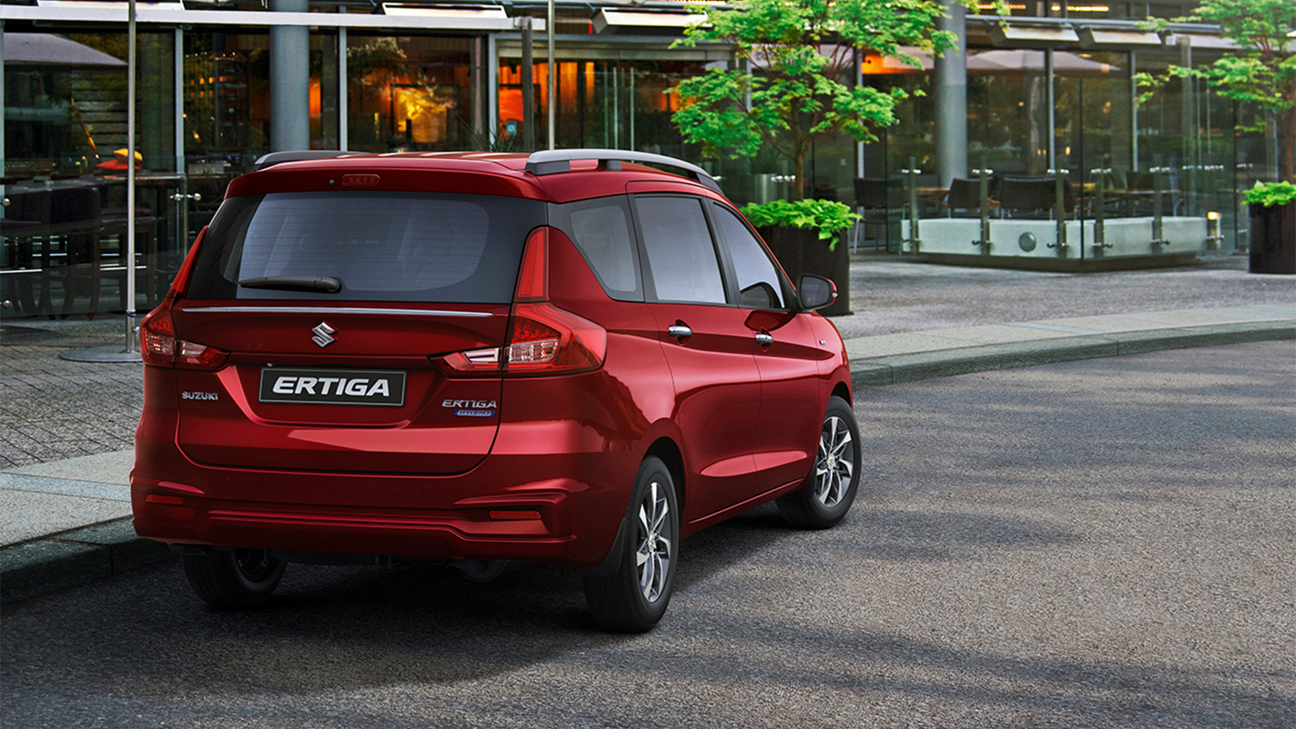 Rear-sho-of-red-Suzuki-Ertiga-parking-at-café