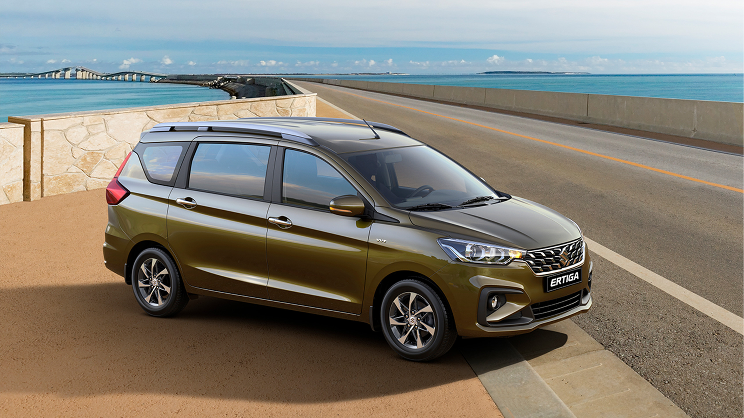 Khaki-Suzuki-Ertiga-driving-to-seaside-road