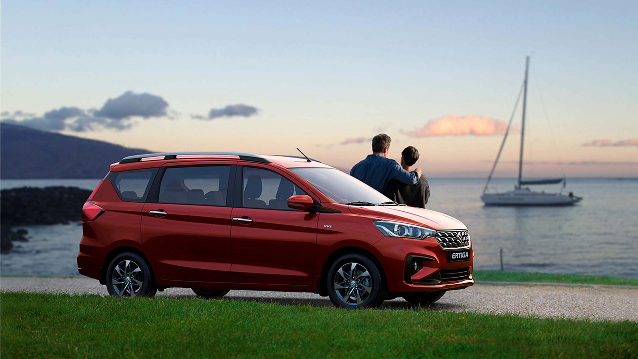 A-husband-and-wife-get-off-Ertiga-and-look-at-a-yacht-in-the-sea-in-evening