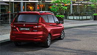 Rear-sho-of-red-Suzuki-Ertiga-parking-at-café