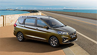 Khaki-Suzuki-Ertiga-driving-to-seaside-road