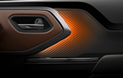 suzuki-e-vitara-interior-door-panel-with-amber-orange-ambient-lighting-close-up