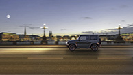 Side-view-of-Jimny-driving-in-the-city