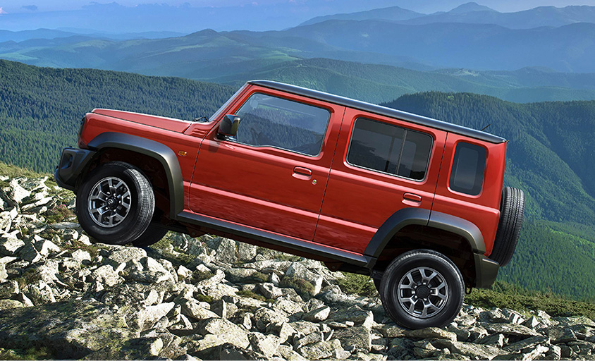 Jimny-5door-running-through-mountain-road-side-shot