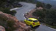 rear-shot-of-Swift-Sport-running-on-winding-road