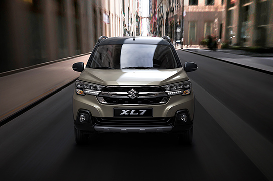 Ivory-Suzuki-XL7-running-between-buildings