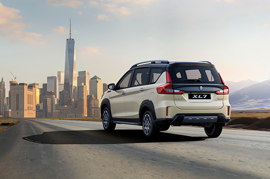 Ivory-Suzuki-XL7-driving-towards-city